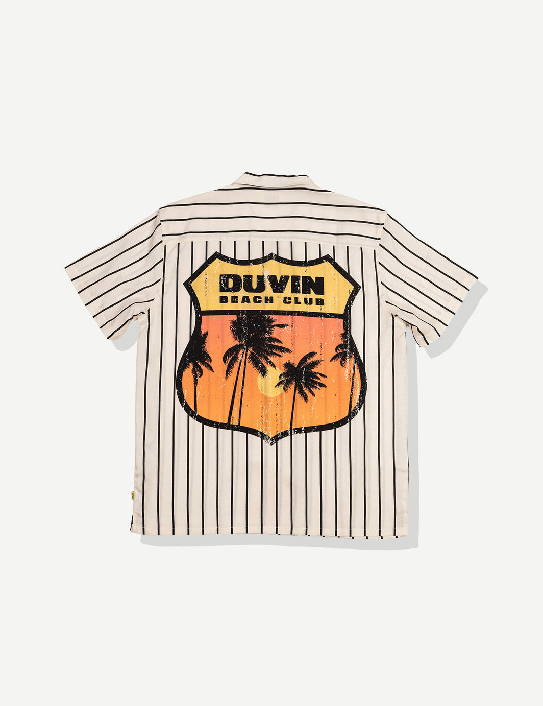 Striped shirt with palm tree design and 'DUVIN Beach Club' text on a white background